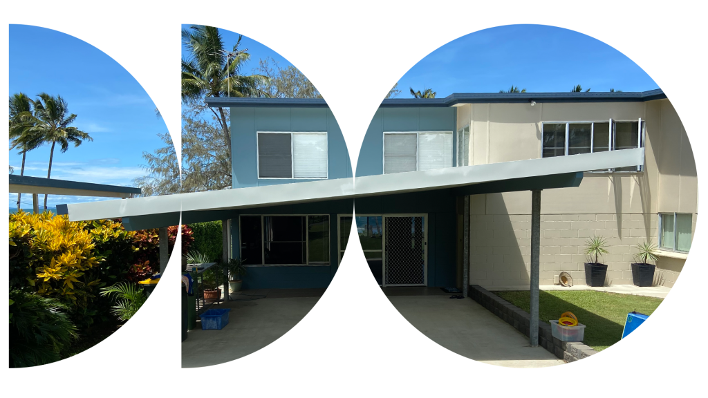 Two-storey blue and cream home with a skillion carport and garden